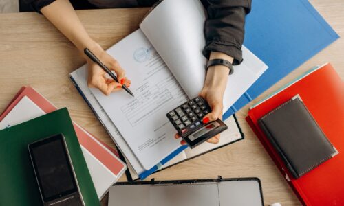 person examining financial documents